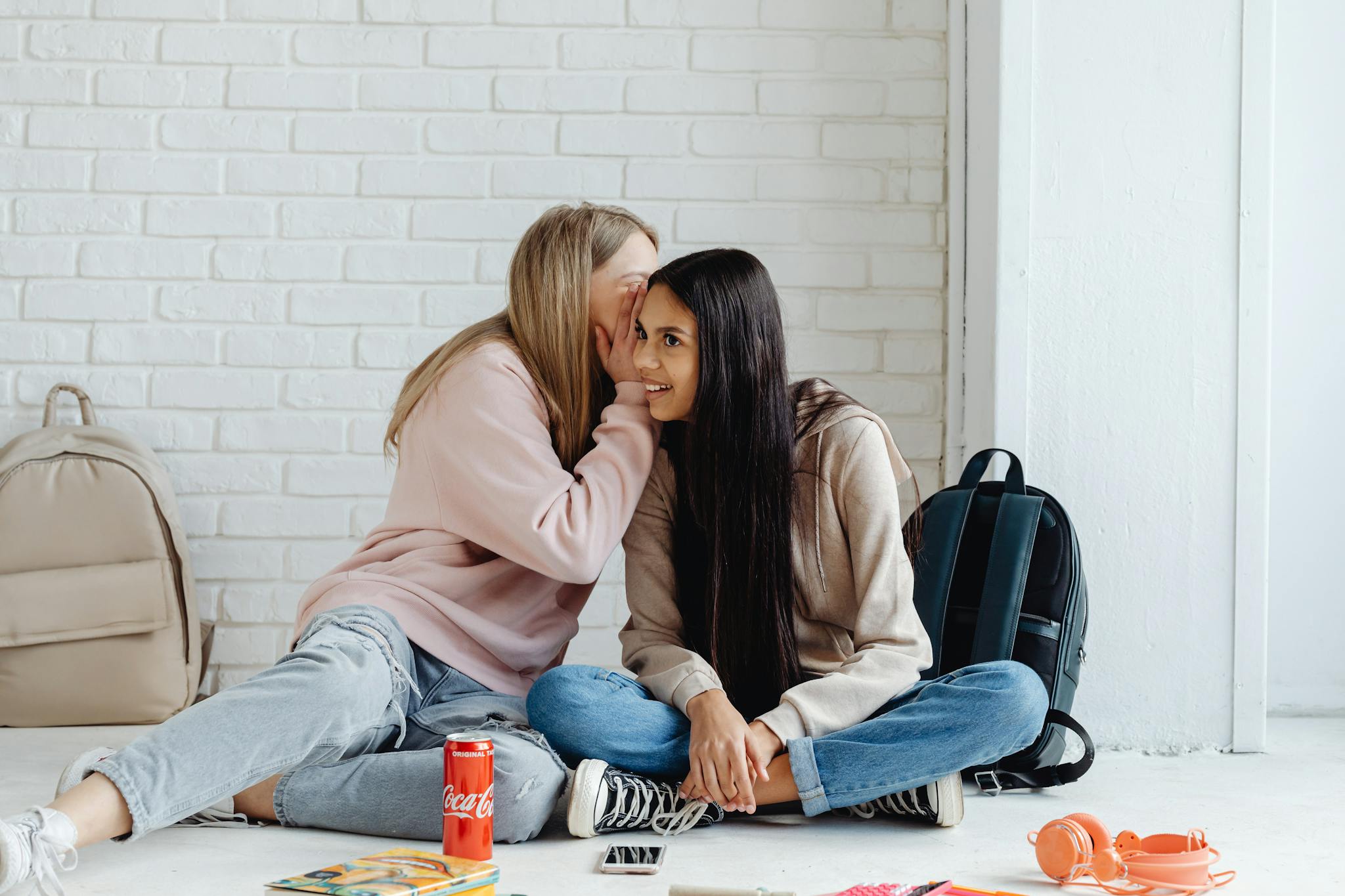 Girls Whispering, and Sitting on Floor